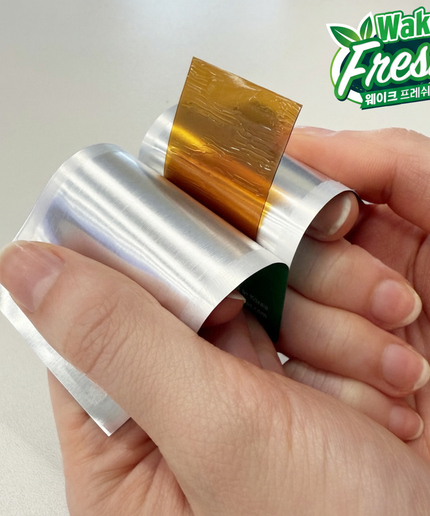 Close-up of Wake Fresh honey-flavored oral dissolving strip – 500mg DHM supplement for rapid hangover recovery and liver detox